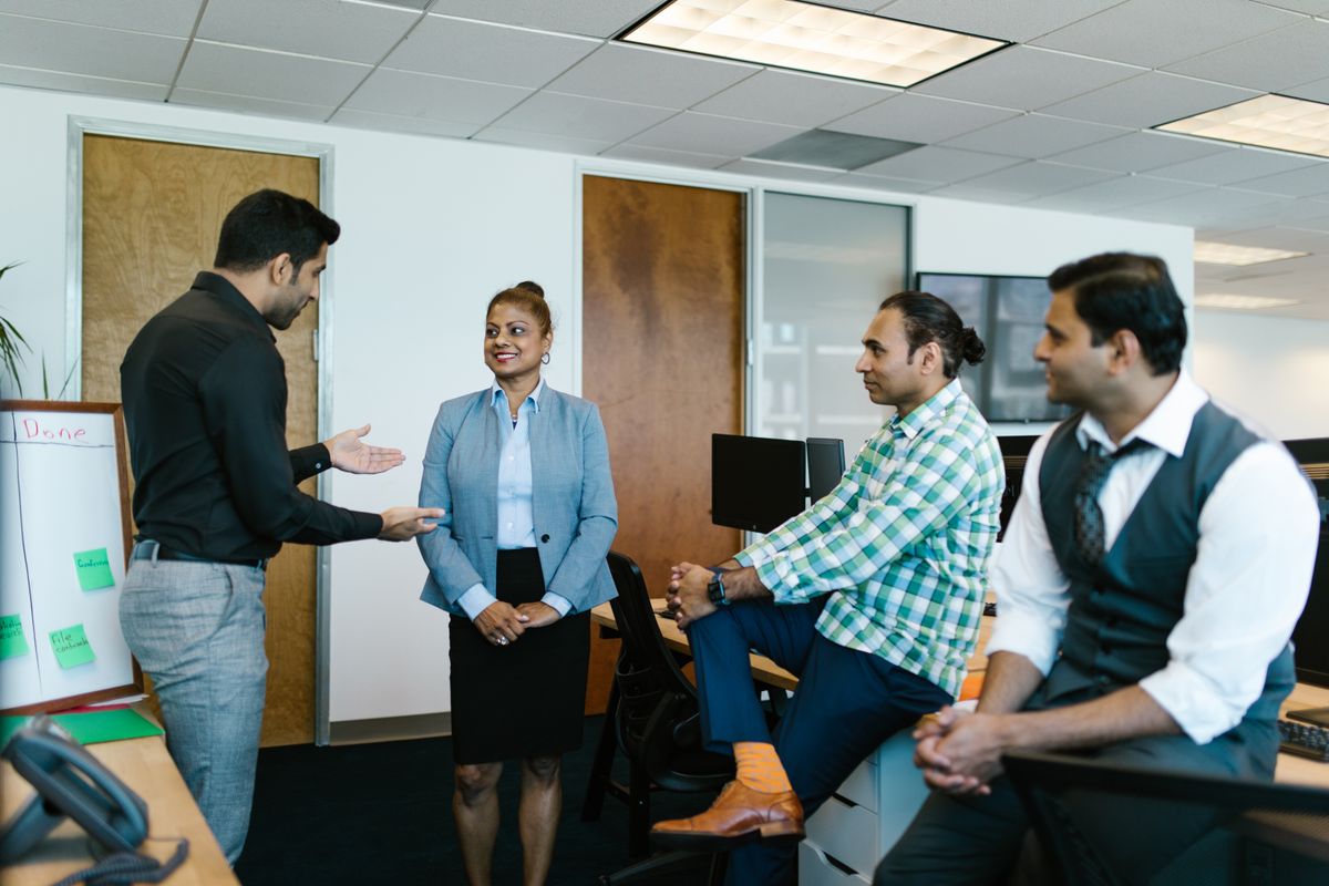 An Indian support team discussing customer chats