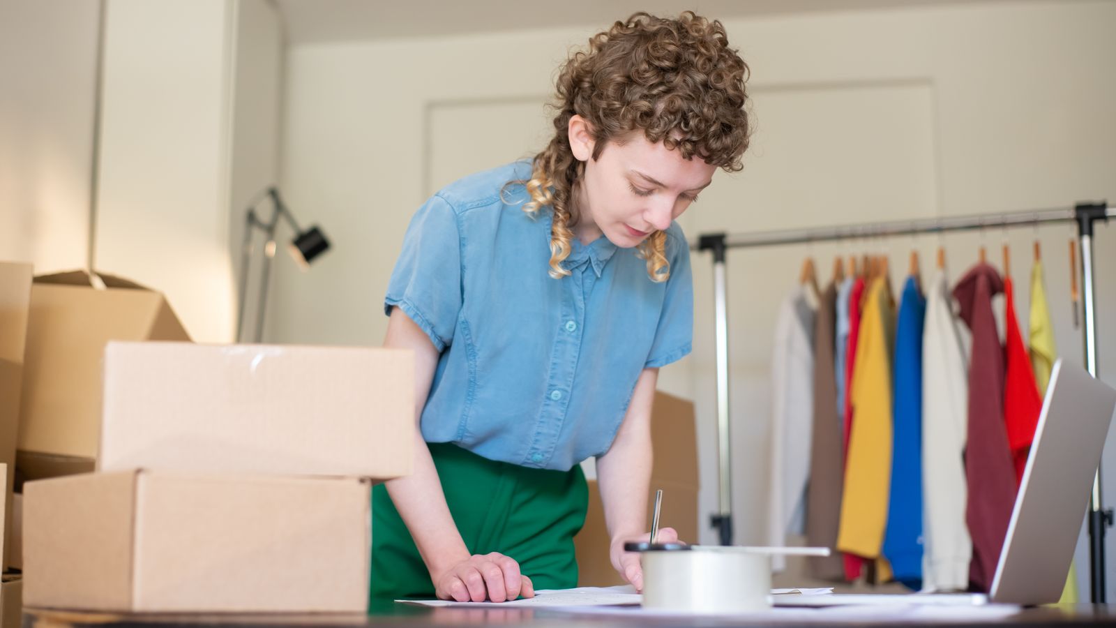 An Indian entrepreneur packing orders at a small business